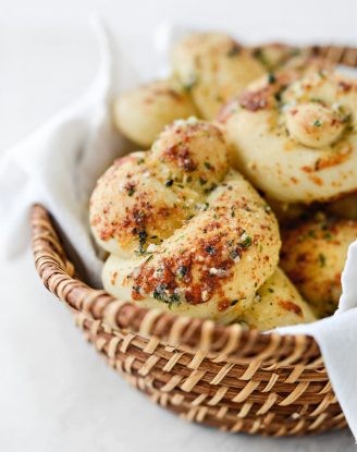 basket of Easy Homemade Garlic Herb Knots