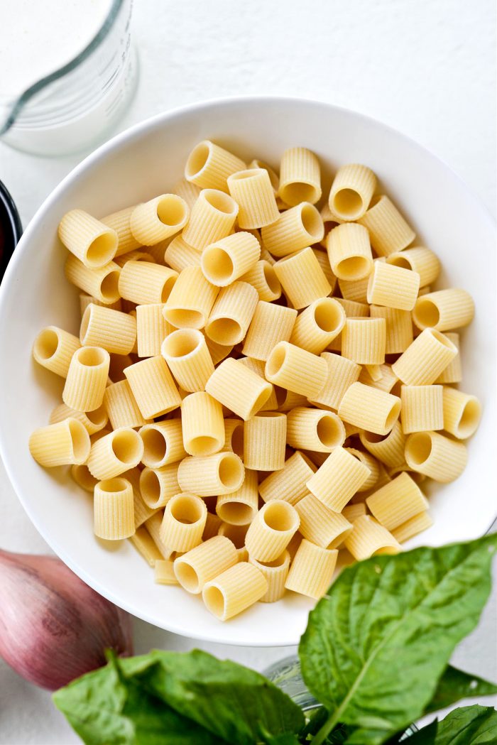 dried pasta in white bowl