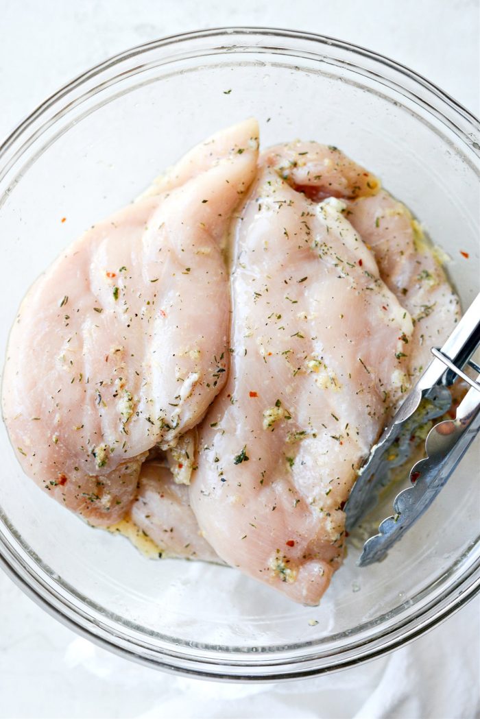 toss chicken to coat in marinade and refrigerate