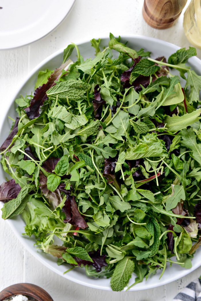 arugula, spring greens, mint and basil on platter