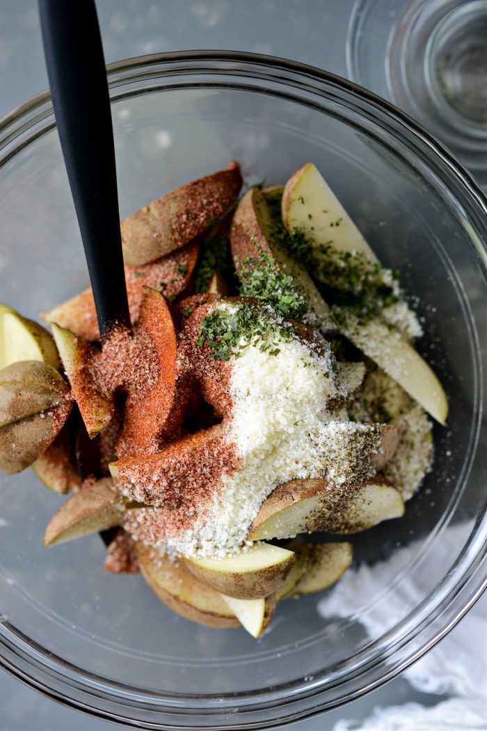 all-purpose seasoning, pecorino, parsley and pepper added to potatoes