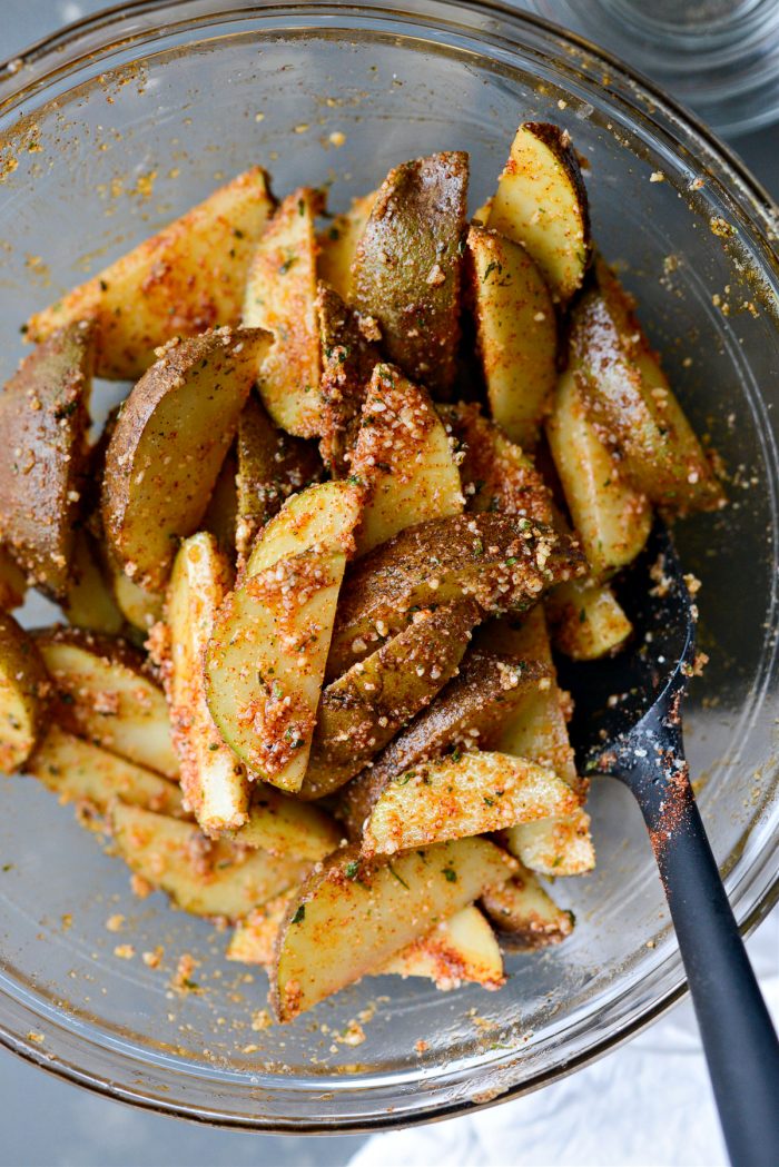 potatoes tossed in oil, herbs and spices