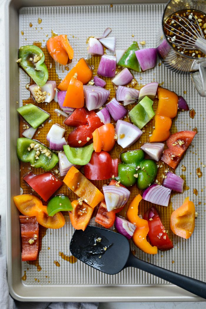 tossing veggies in sauce