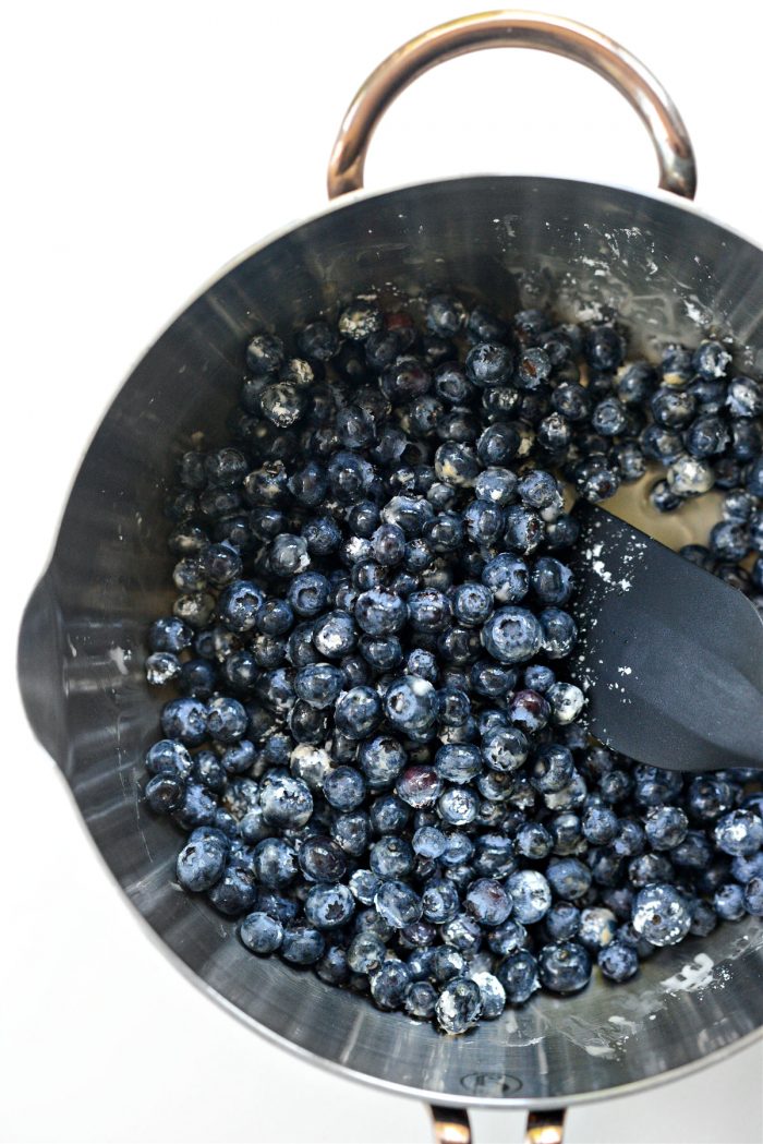 stir ingredients into blueberries