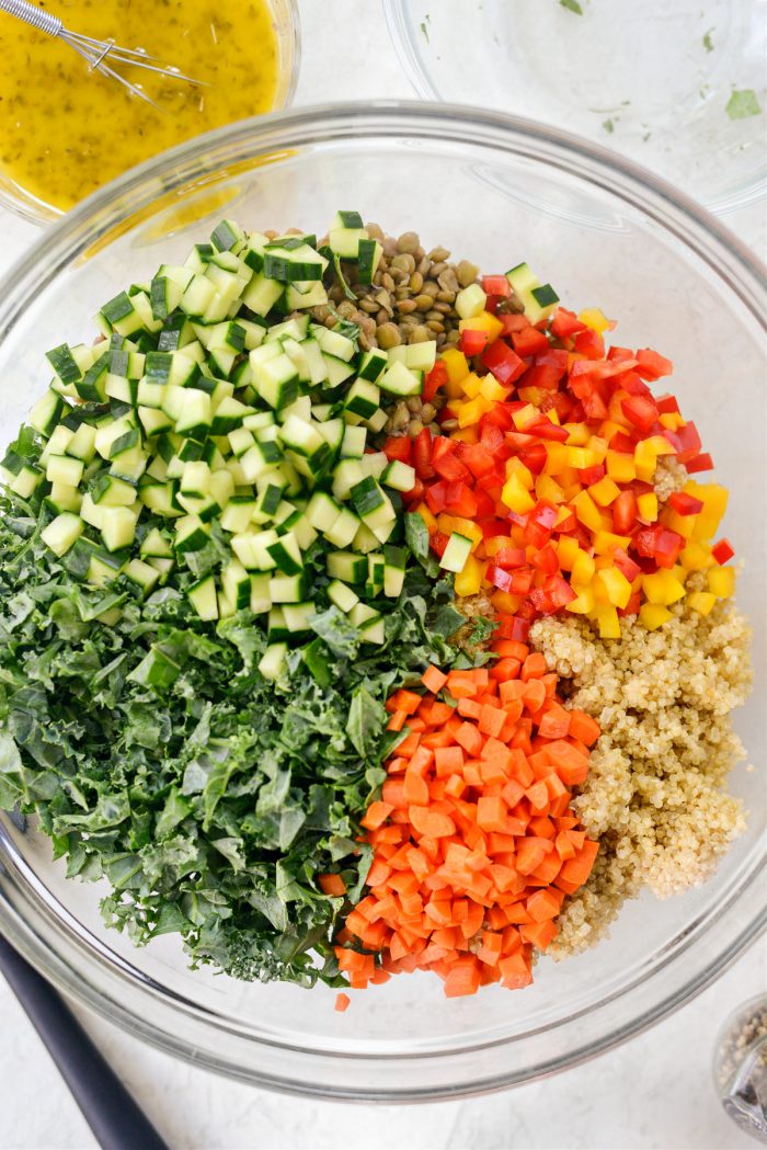 kale and veggies added to bowl