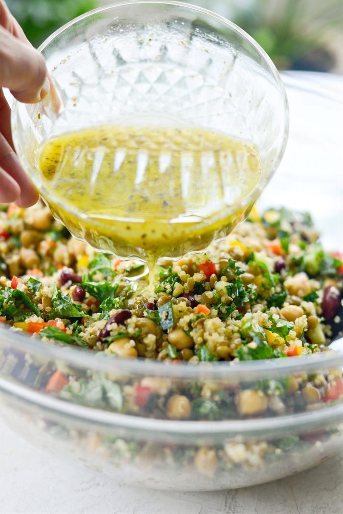 pouring dressing over salad