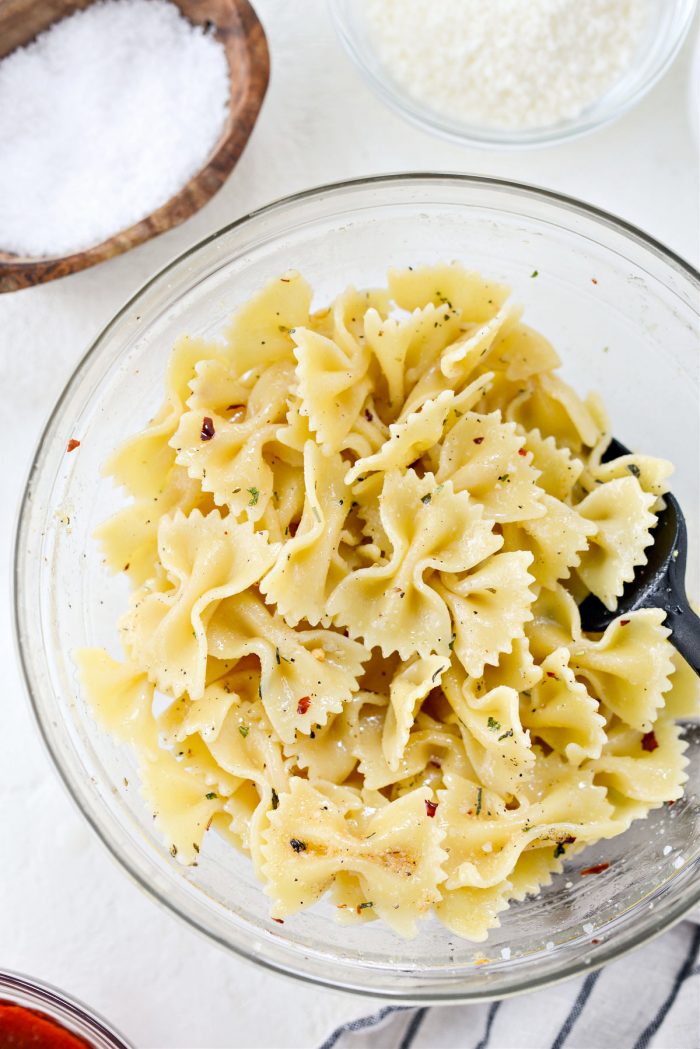 toss pasta in oil and spices