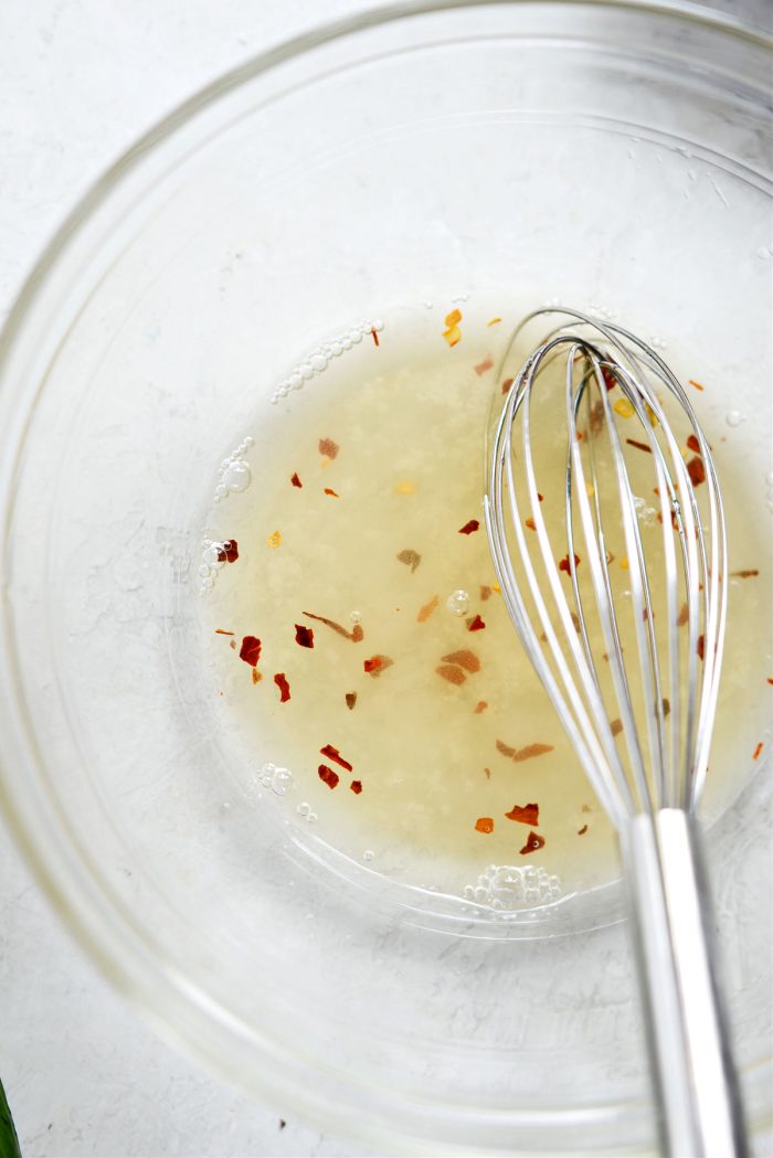 honey, rice vinegar, water and red pepper flakes in bowl.