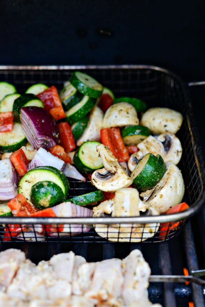 add veggies to grill basket