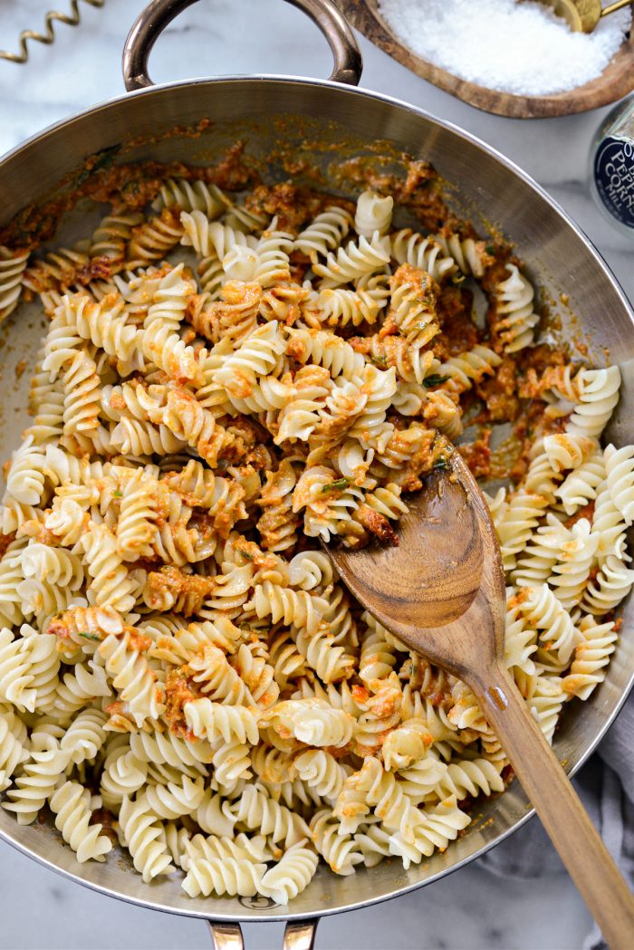 toss pasta in sauce