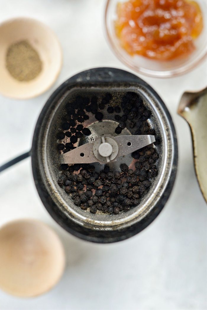 peppercorns in grinder