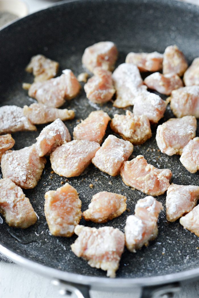 add coated chicken to hot skillet