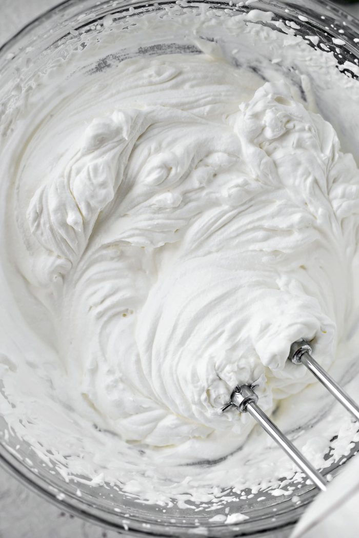 whip heavy cream until stiff peaks form