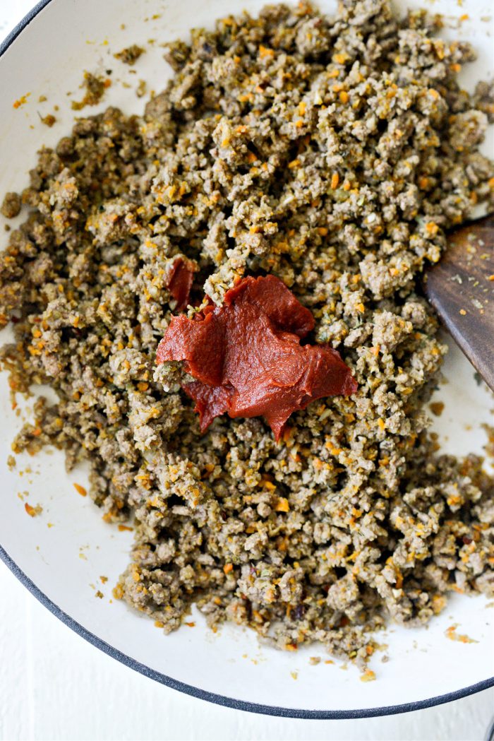 add tomato paste to meat mixture