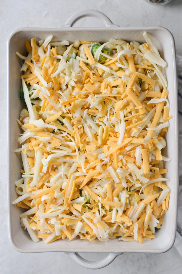 transfer to casserole dish and top with remaining cheese