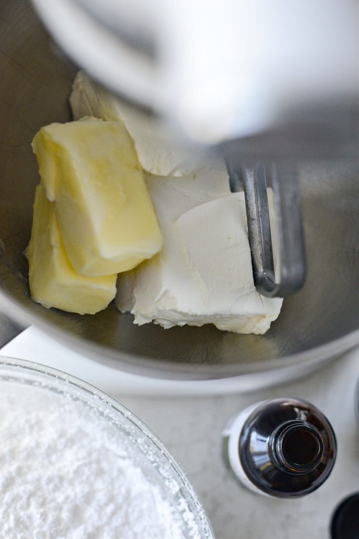 softened butter and cream cheese in bowl of mixer