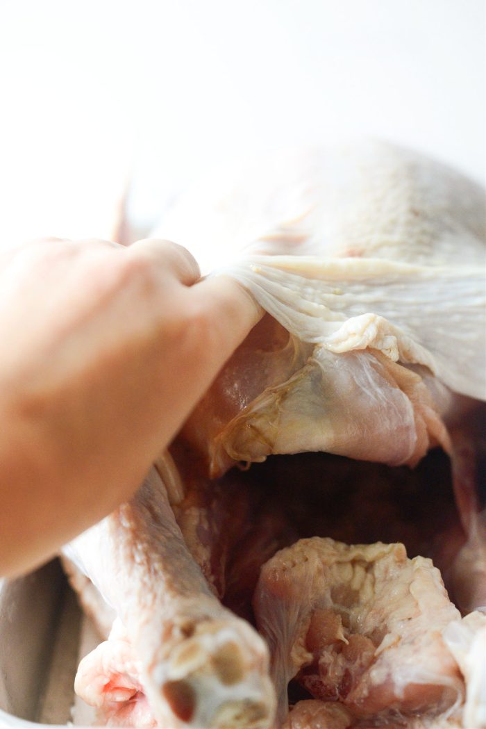 lift skin away from. breast meat