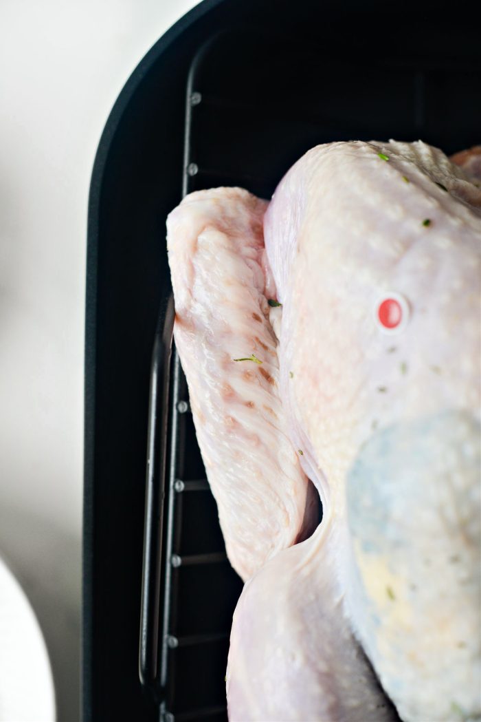 tuck the wings under the turkey