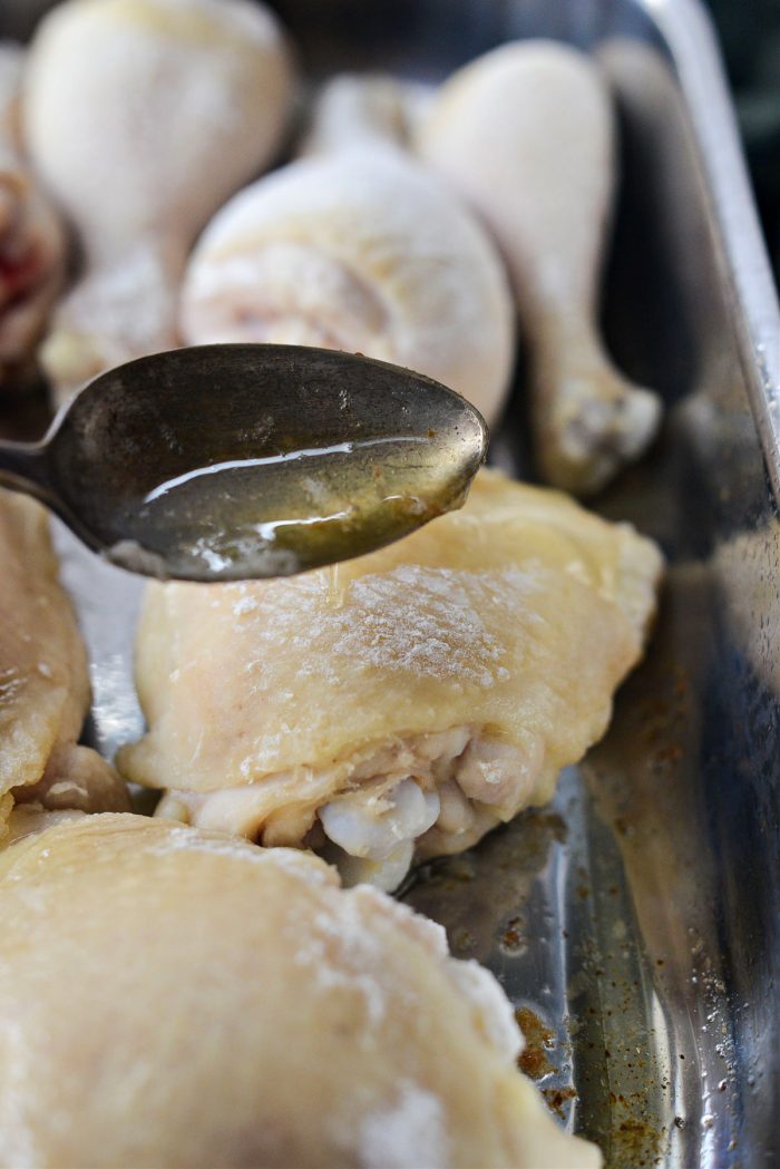 spoon drippings over chicken
