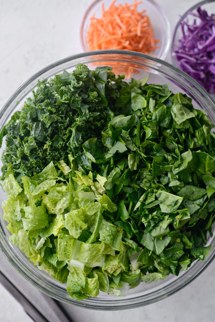 kale, spinach and romaine in a large bowl