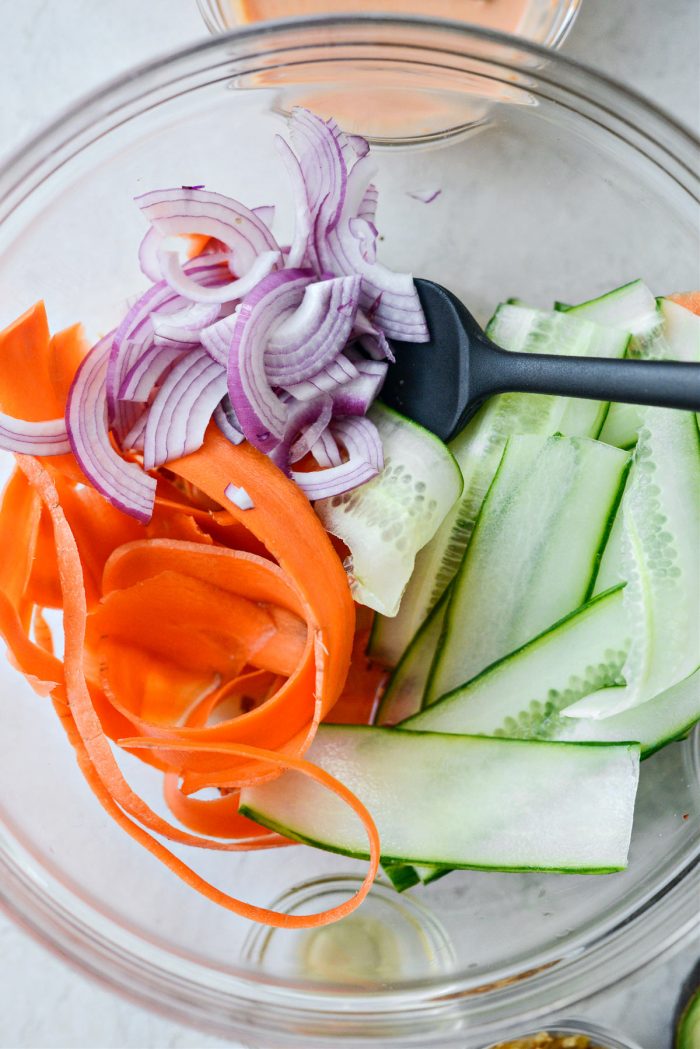 thinly sliced carrots, onion and cucumber