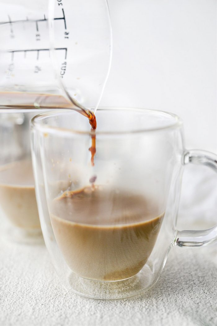 add espresso to eggnog in mug