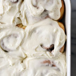 close up of frosted cinnamon rolls