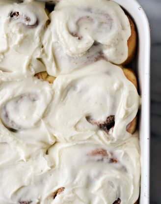 close up of frosted cinnamon rolls