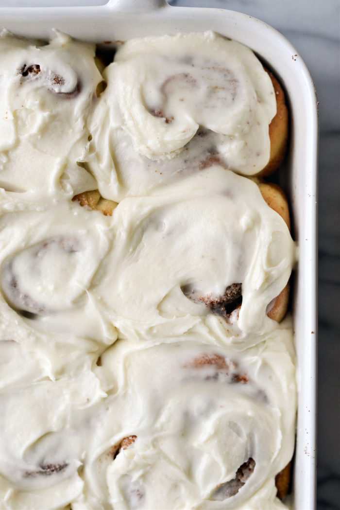 close up of frosted cinnamon rolls
