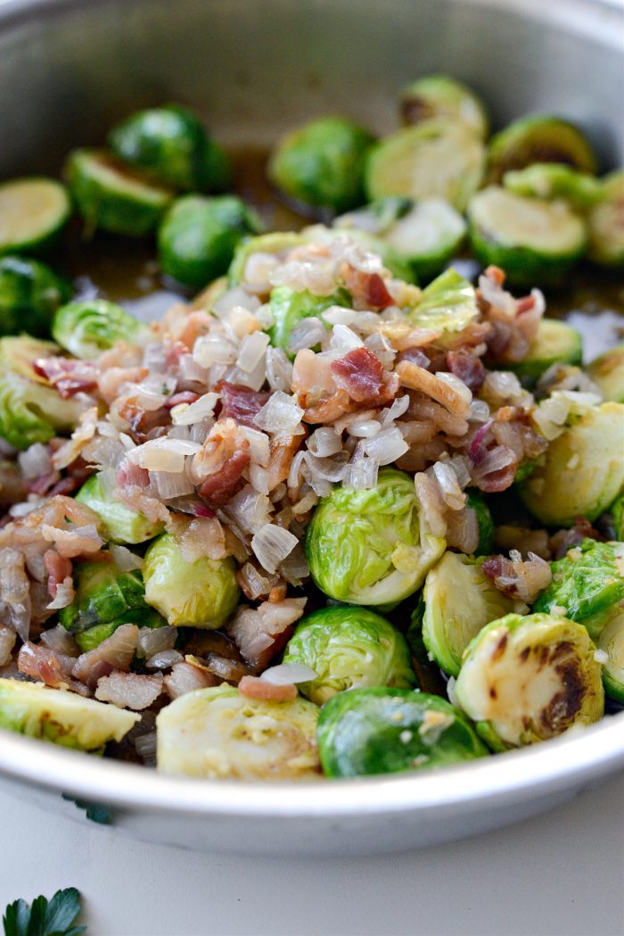 add brussels and bacon back to pan