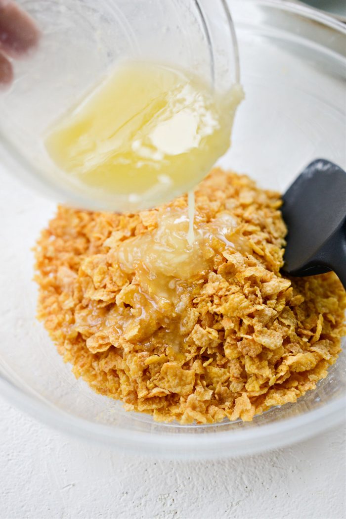 add remaining butter to crushed cornflakes