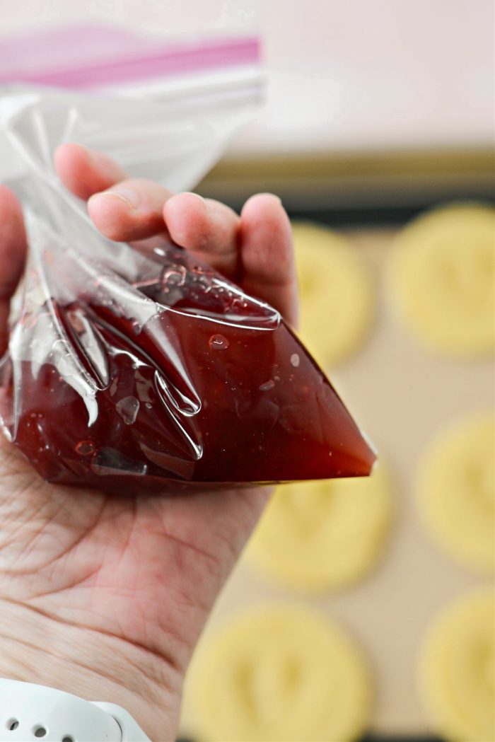 add jam to a piping bag or resealable baggie