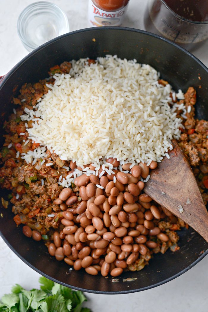 add pinto beans and cooked rice