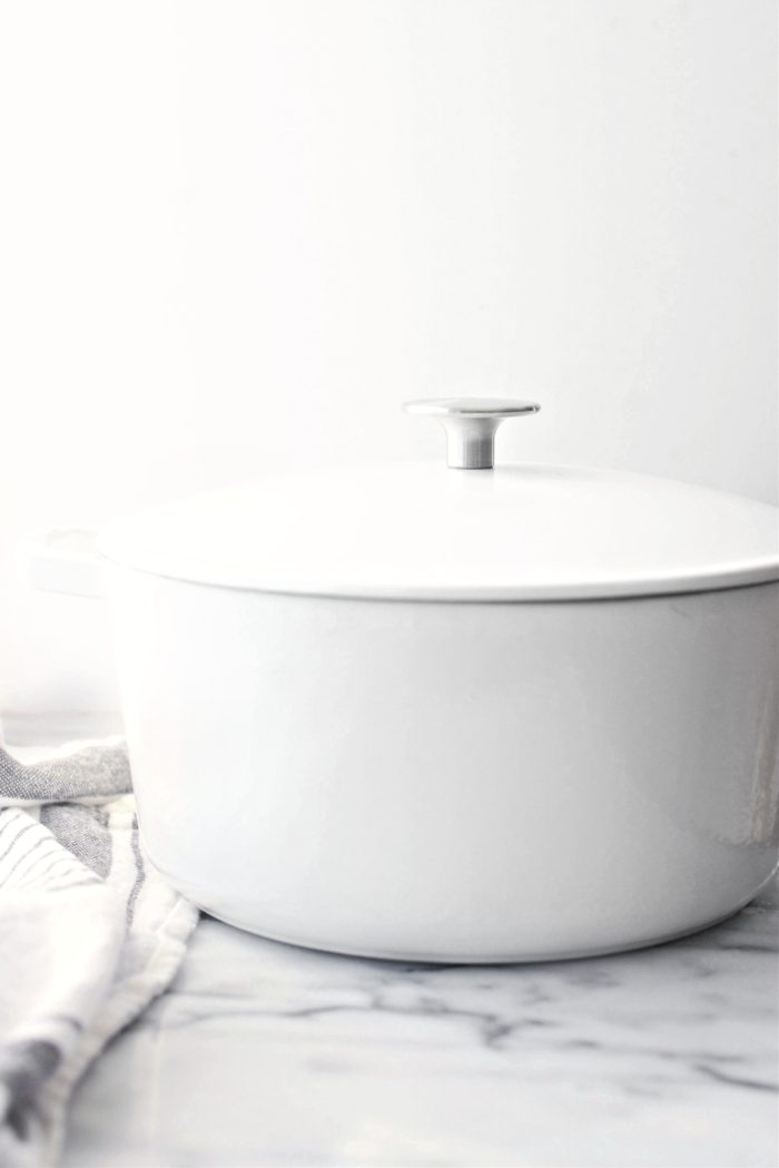 Preheat the oven with a covered pot inside