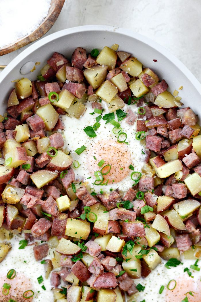 season with salt and pepper, then top with dark parts of green onion and minced parsely