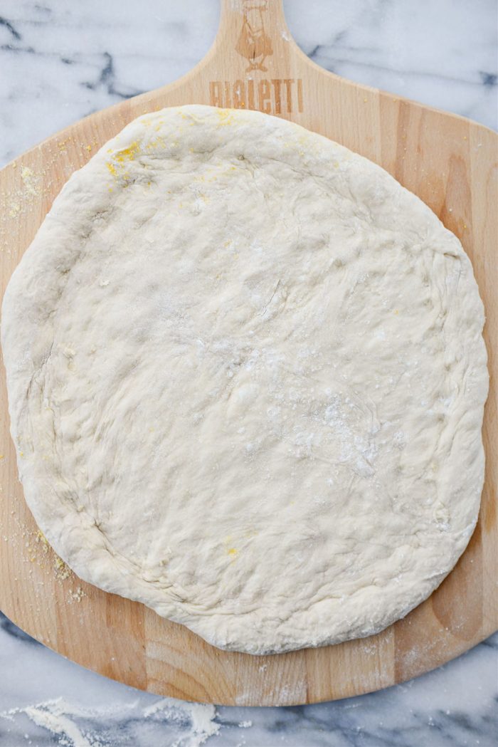 stretched dough on peel