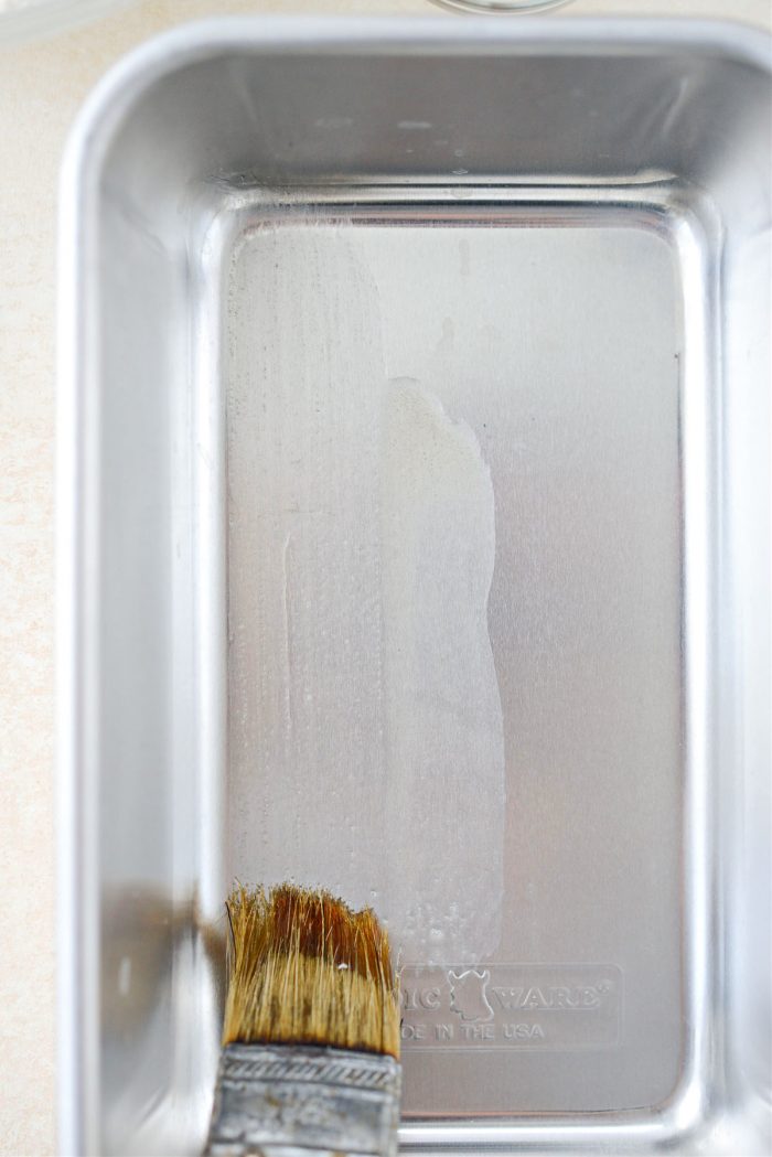 brush a large bread loaf pan with some of the butter.