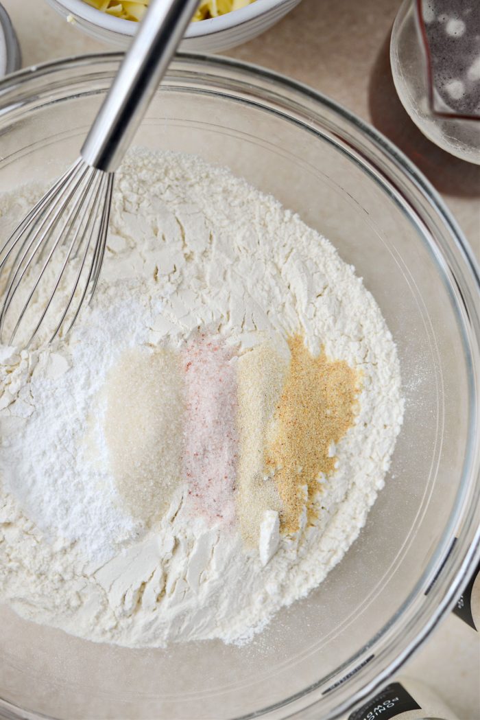 measure and add dry ingredients to a mixing bowl.