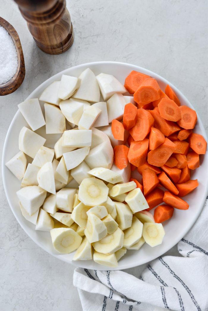 Plate of chopped carrot, parsnip and turnip