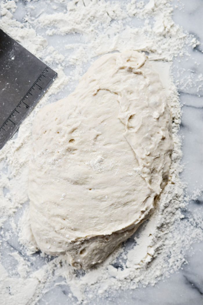 scrape out of bowl and onto floured surface