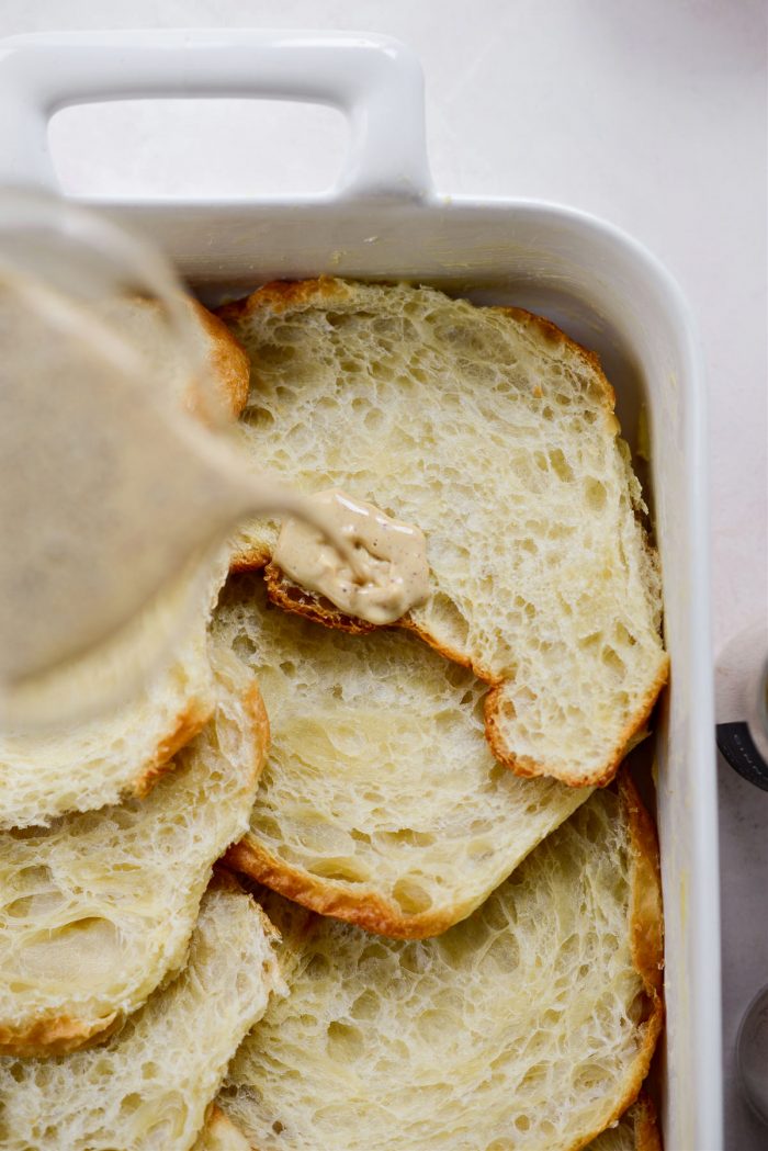 pour half of the egg mixture over croissant halves