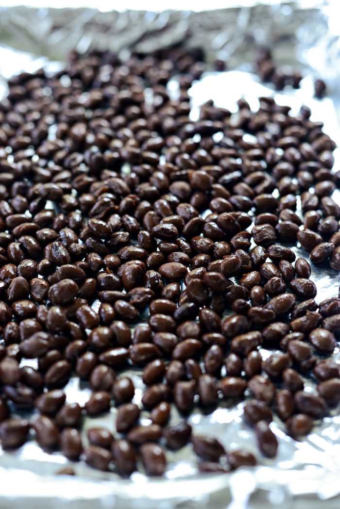 drained black beans on rimmed sheet pan