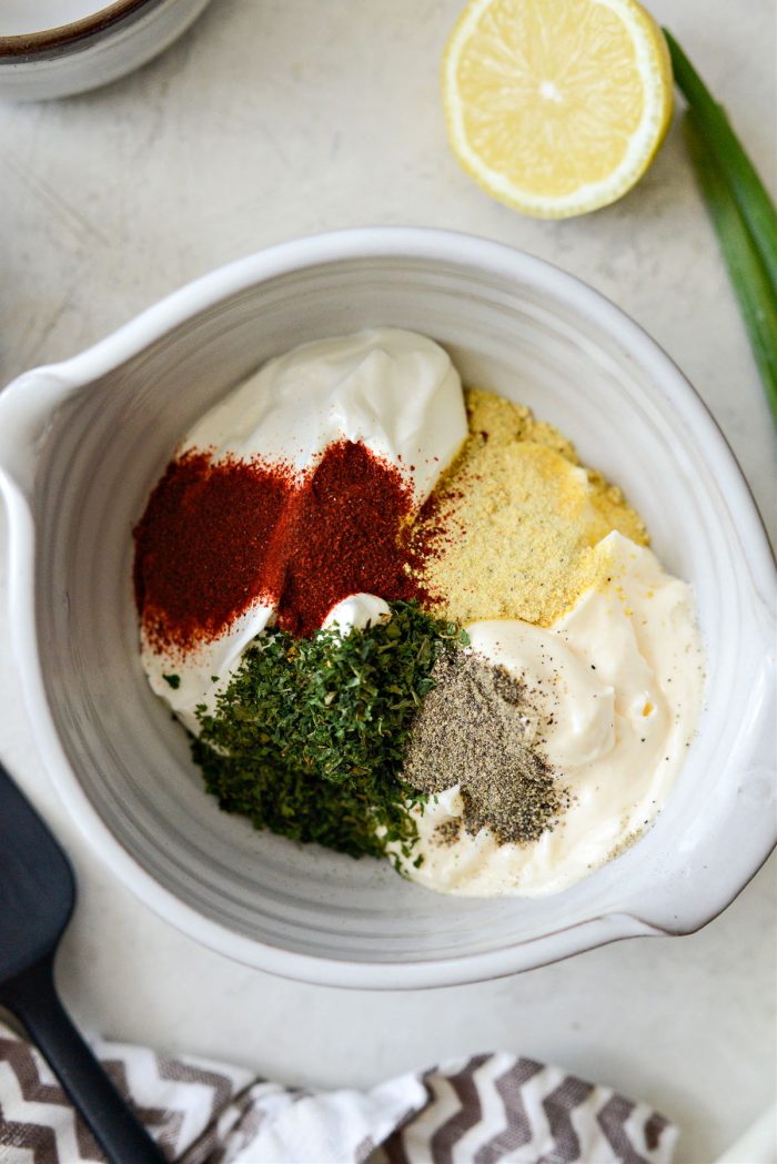 mayo, sour cream, herbs and spices in a bowl