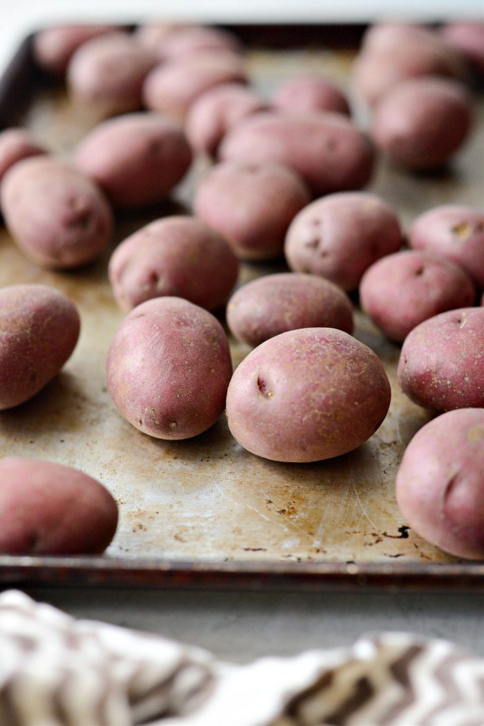 potatoes on a rimmed baking sheet