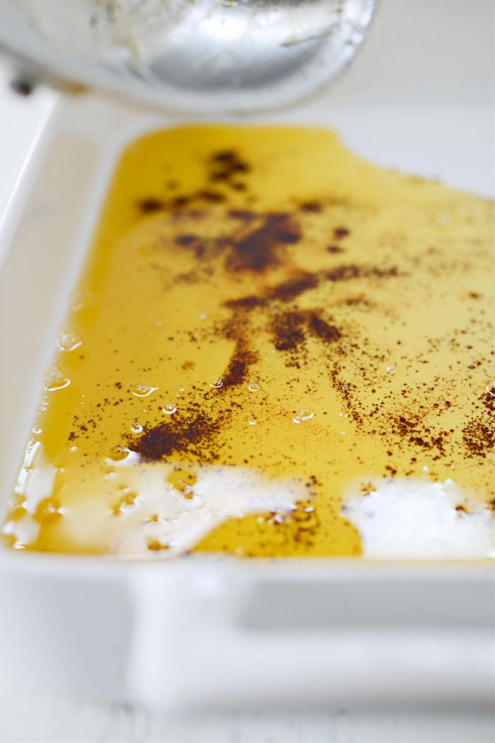 pouring brown butter into baking dish