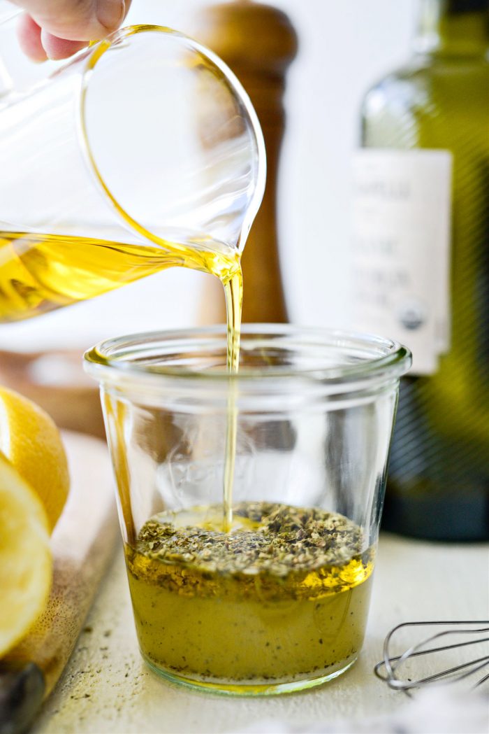 pouring oil into jar