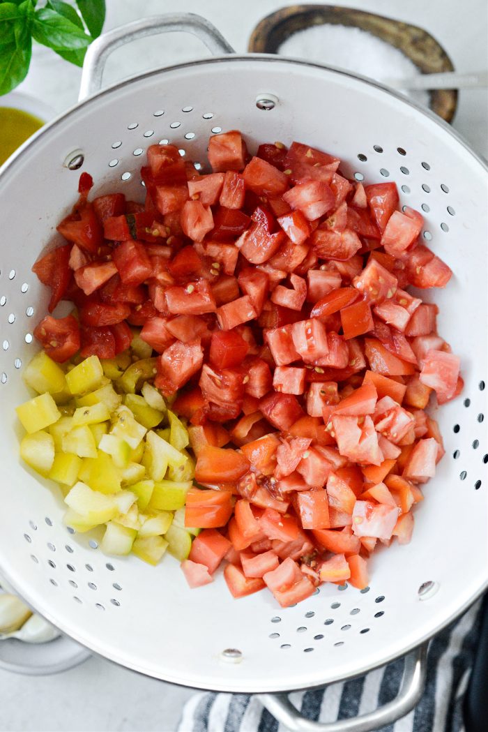 chopped tomatoes in white colander