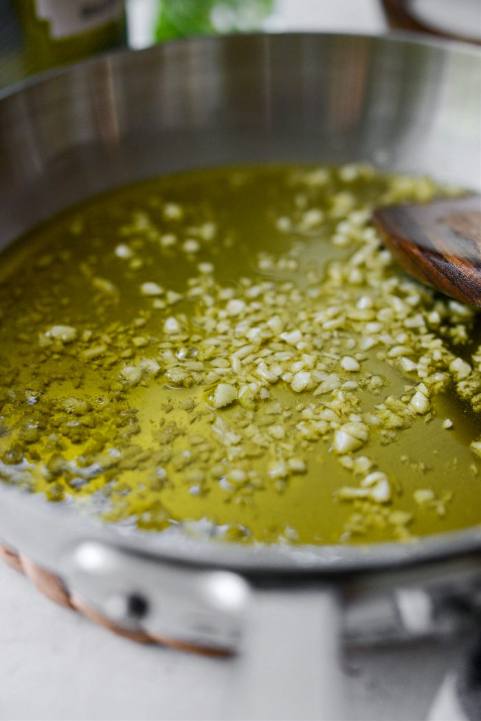 simmer until garlic is soft and let cool