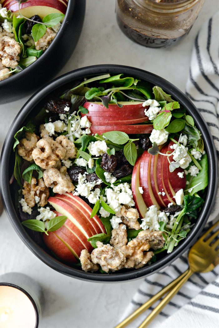 fill bowls and top with apples, dried cherries, candied walnuts and blue cheese