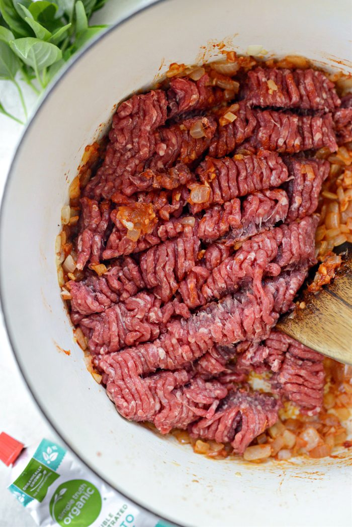 ground beef added to onions and garlic